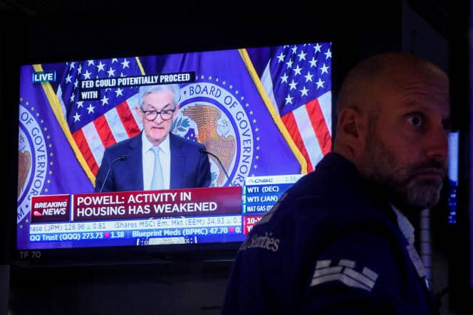 A trader reacts to US Federal Reserve Chairman Jerome Powell's announcement to raise interest rates, at the New York Stock Exchange, November 2, 2022.  