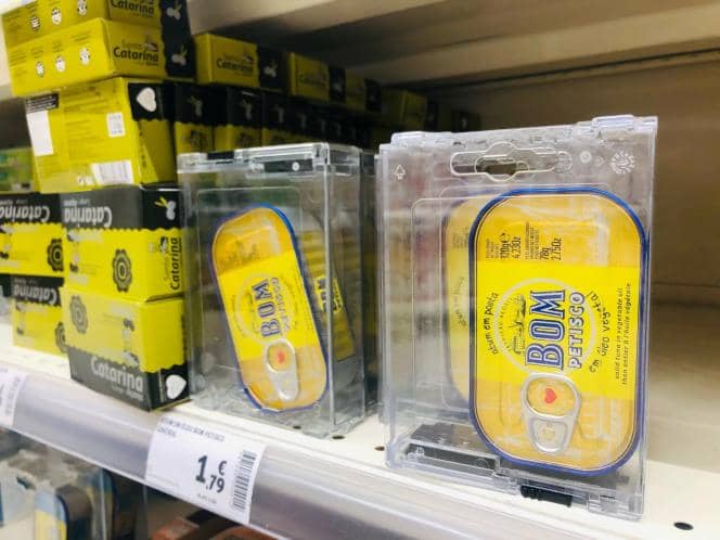 Cans of tuna are equipped with locks to deal with the resurgence of thefts, in a Portuguese supermarket.