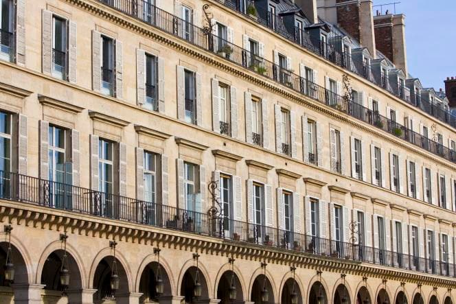 The buildings of the rue de Rivoli, in Paris, with a view of the Tuileries garden.
